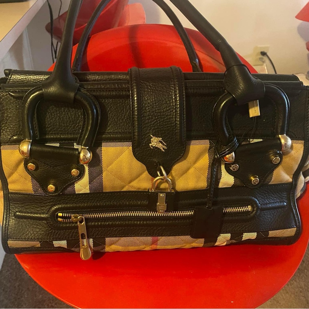 SOLD.Authentic Burberry bag. It is a little bit heavy due to the hardware